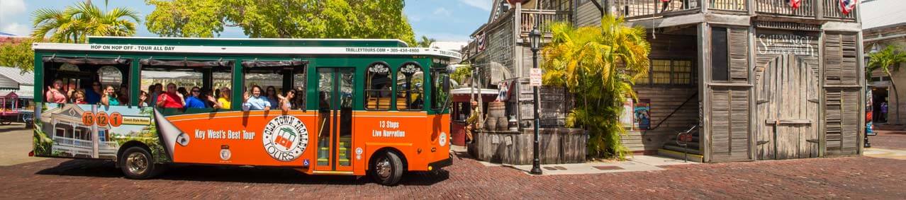 An Old Town Trolley Tour approaching the Shipwreck Museum in Key West, FL