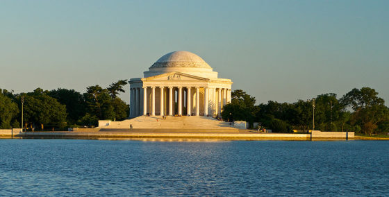 view of Jefferson Memorial made up of a dome and columns sitting on the tidal basin in Washington DC
