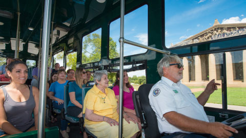 interior of Nashville Old Town Trolley vehicle with guests looking out the window at Nashville Parthenon