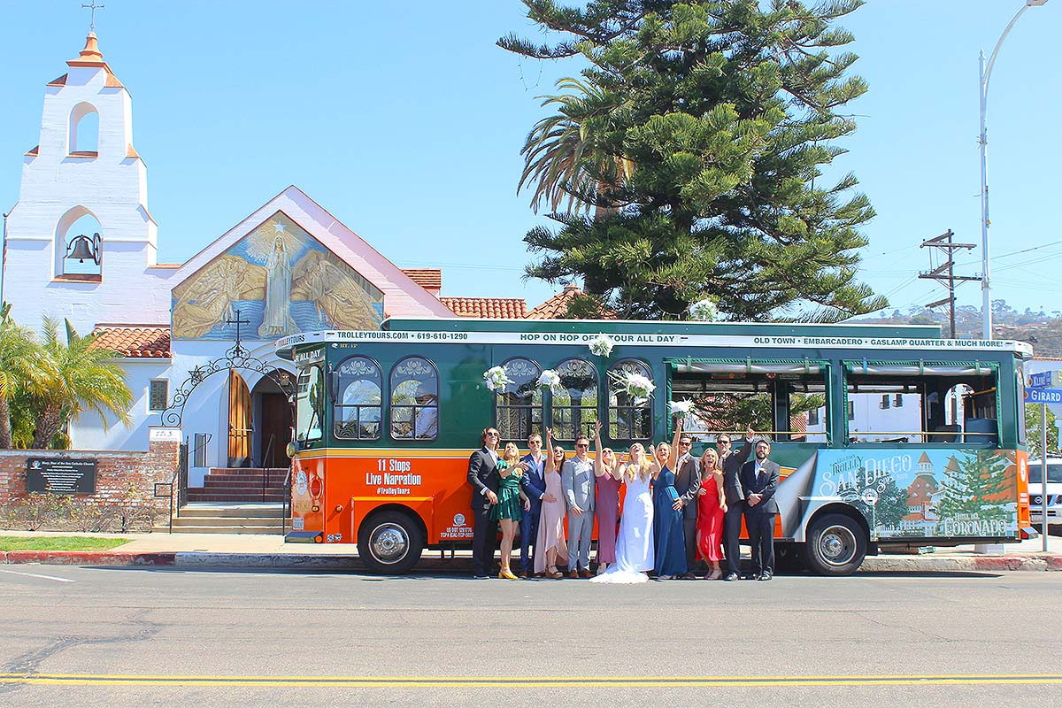 San Diego wedding party and orange and green trolley