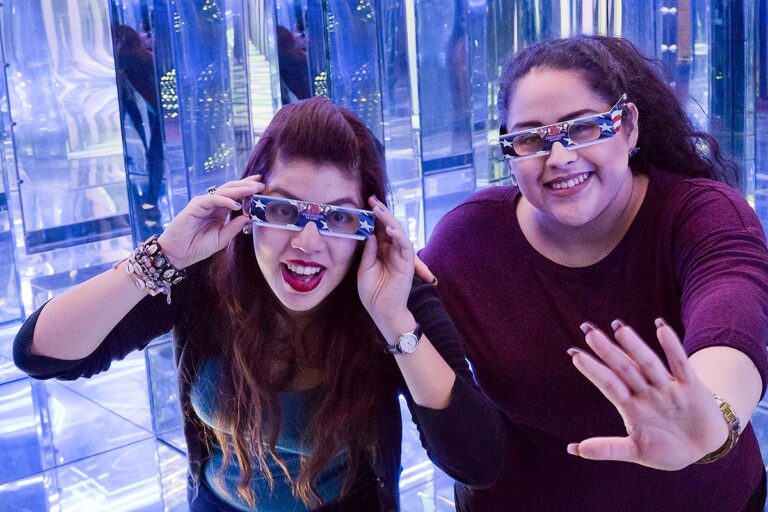 two guests inside mirror maze