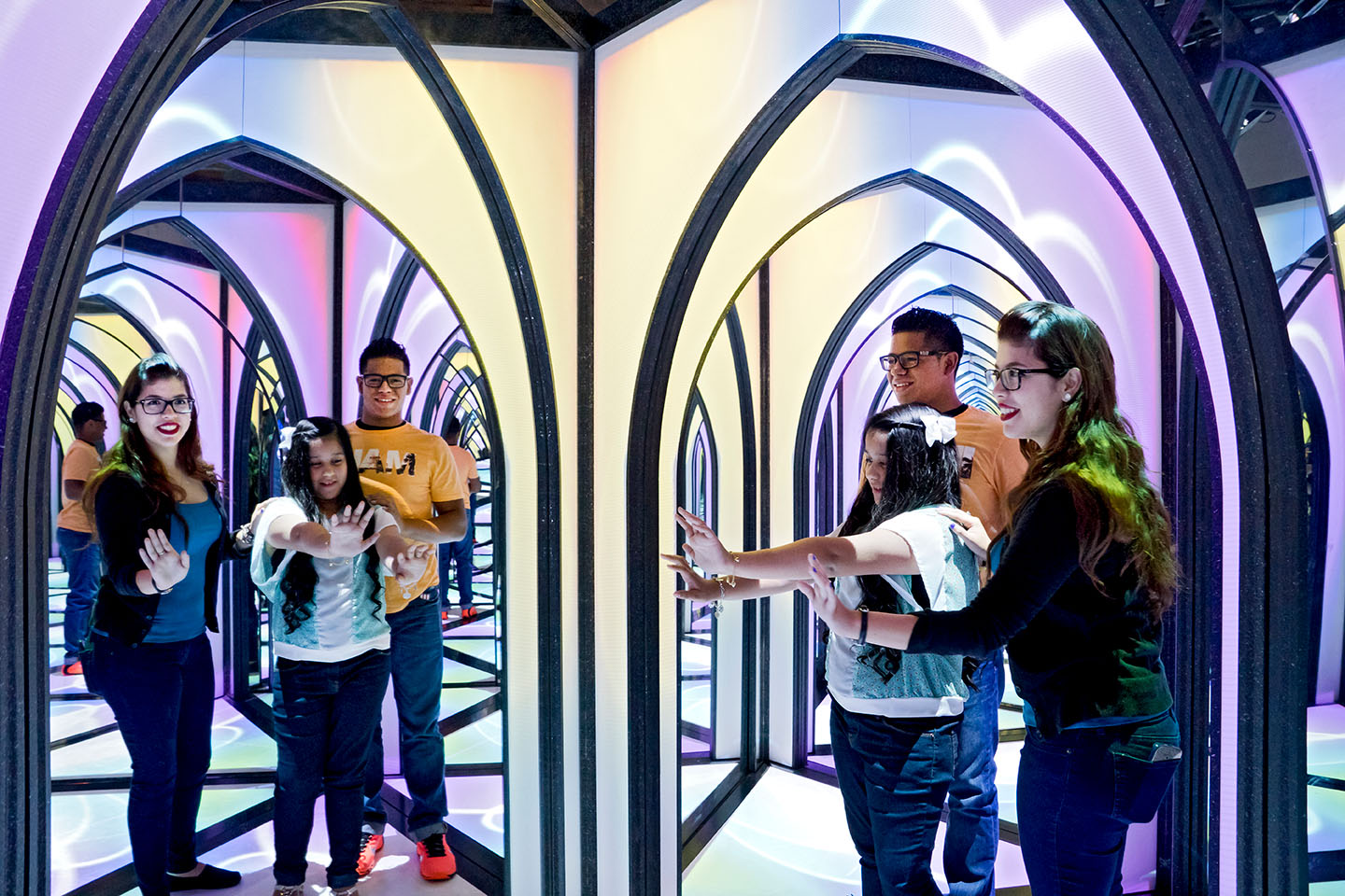 people inside the mirror maze