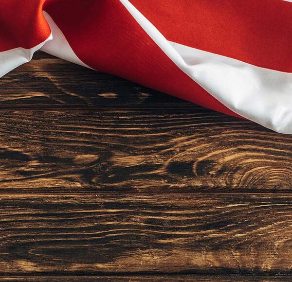 US flag set against wood boards