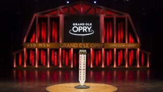 Grand Ole Opry: A Legacy of Country Music History - Iconic Grand Ole Opry stage in Nashville, Tennessee, showcasing classic microphone and wooden accents