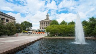 Tennessee State Capitol Legislative Plaza: A Historic Landmark of Governance - Tennessee State Capitol with greenery and historical monuments.